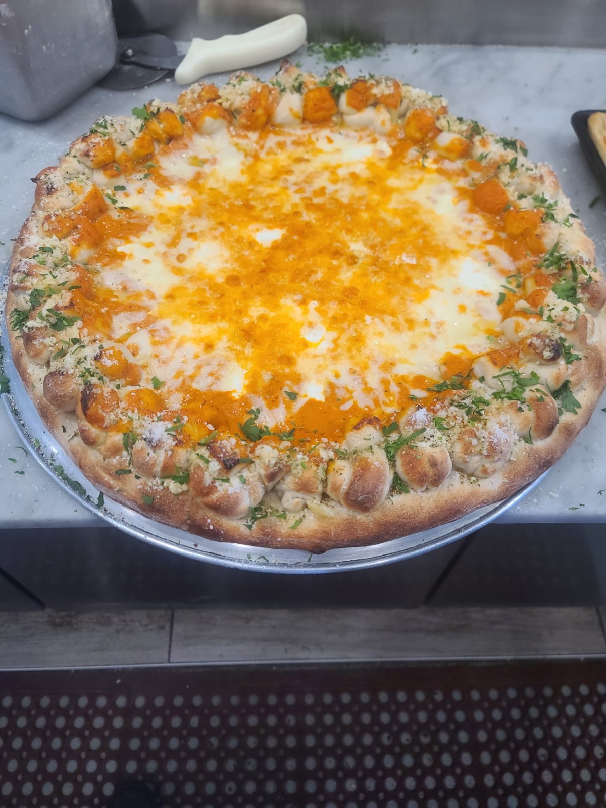 Round pizza with golden cheese and a stuffed crust