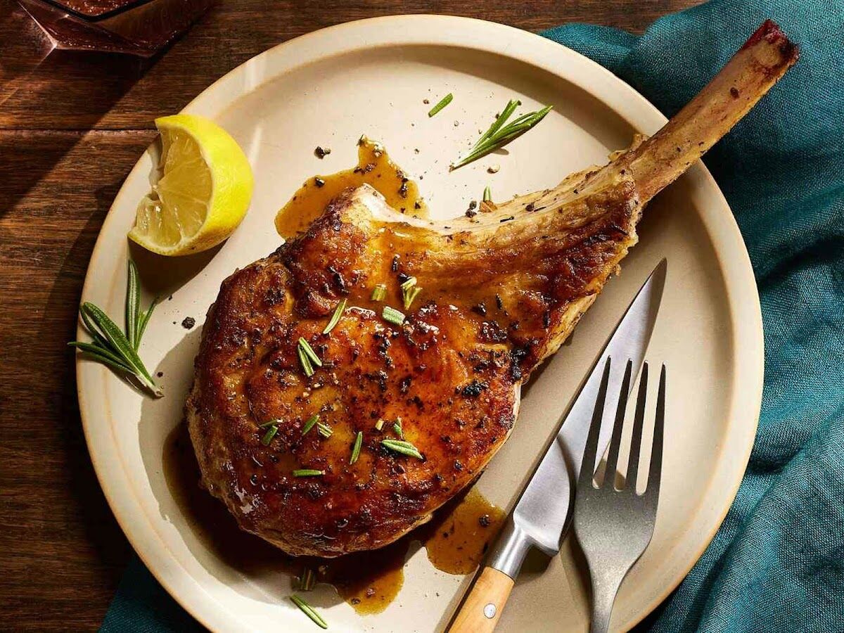 Grilled bone-in chop with lemon and herbs