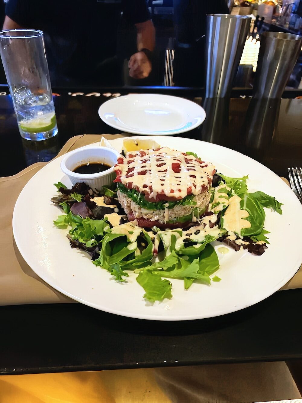 Plated salad with a stacked topping